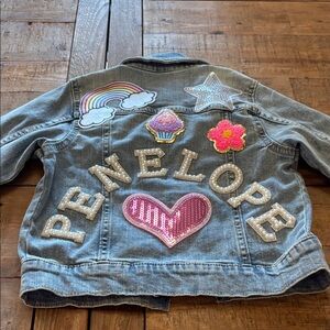 Okie Dokie Denim Jacket with Colorful Patches that spell out Penelope.